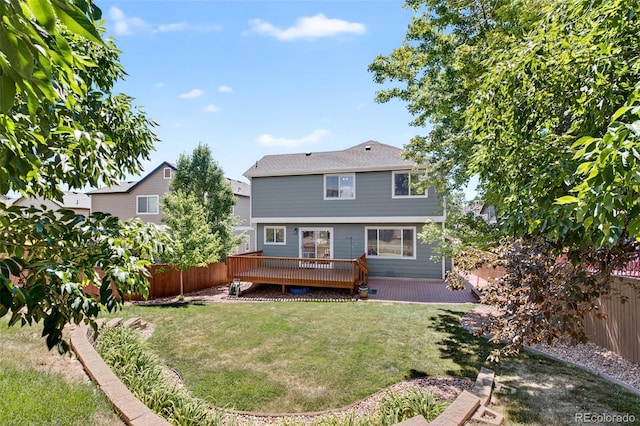 4535 Hunterwood Dr, Highlands Ranch, CO 80130 - back of property with a wooden deck and a fenced backyard