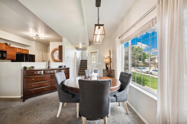 5302 Canadian Rose Vw, Colorado Springs, CO 80916 - carpeted dining space featuring stairway, plenty of natural light, and baseboards