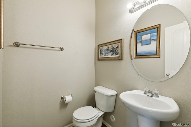 5302 Canadian Rose Vw, Colorado Springs, CO 80916 - half bathroom with toilet, a sink, and baseboards