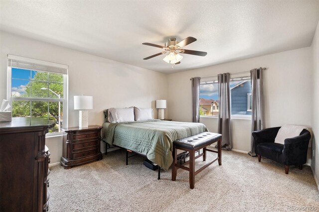 5302 Canadian Rose Vw, Colorado Springs, CO 80916 - bedroom featuring light carpet, a ceiling fan, and baseboards