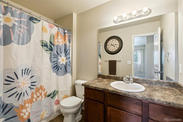 5302 Canadian Rose Vw, Colorado Springs, CO 80916 - bathroom featuring vanity, toilet, and a shower with shower curtain