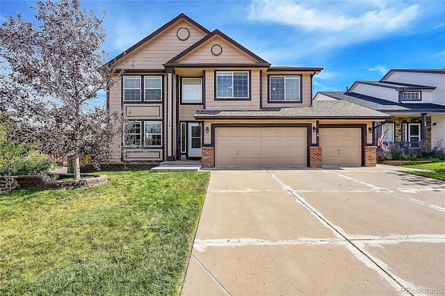 view of front facade with a garage and a front lawn