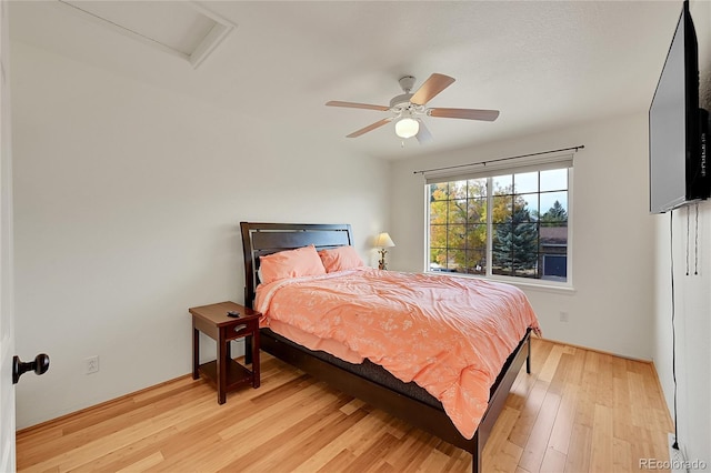 bedroom with light wood-type flooring and ceiling fan