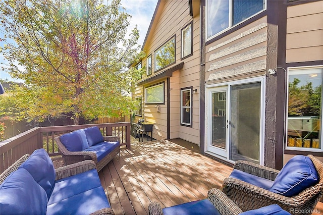 wooden terrace featuring an outdoor hangout area