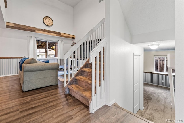 stairway featuring wood-type flooring