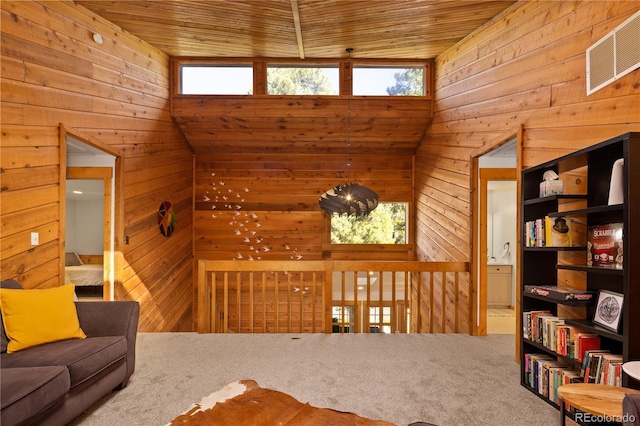 32217 Buffalo Park Rd, Evergreen, CO 80439 - living room with wood ceiling, wooden walls, and carpet flooring