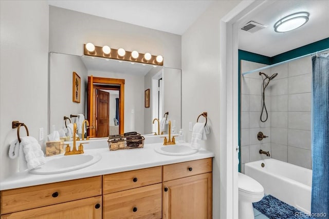 32217 Buffalo Park Rd, Evergreen, CO 80439 - bathroom featuring double vanity, toilet, shower / bathtub combination with curtain, and tile patterned floors