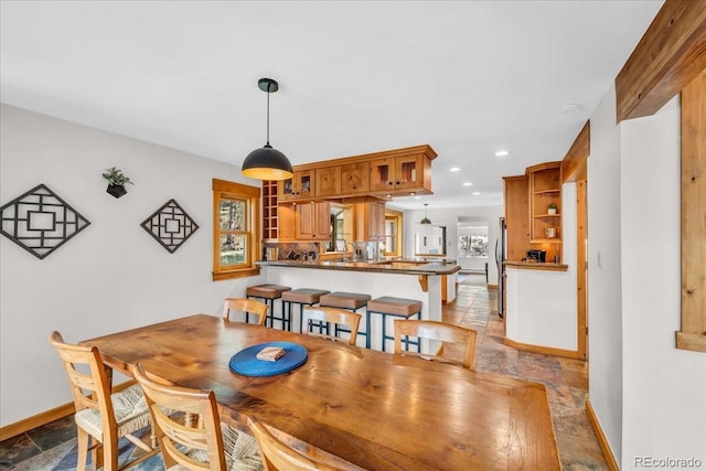 32217 Buffalo Park Rd, Evergreen, CO 80439 - dining space with stone tile floors, baseboards, and recessed lighting