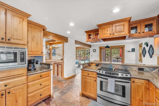 32217 Buffalo Park Rd, Evergreen, CO 80439 - kitchen featuring stainless steel appliances, recessed lighting, decorative backsplash, stone tile floors, and glass insert cabinets