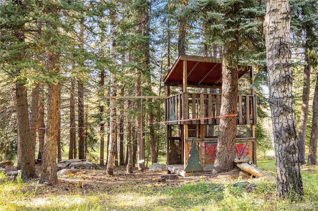 32217 Buffalo Park Rd, Evergreen, CO 80439 - view of outdoor structure featuring a forest view