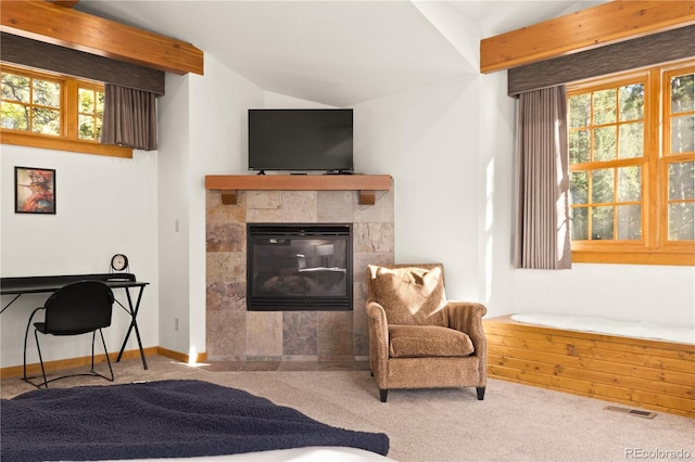 32217 Buffalo Park Rd, Evergreen, CO 80439 - carpeted living room featuring vaulted ceiling, plenty of natural light, a tile fireplace, and baseboards