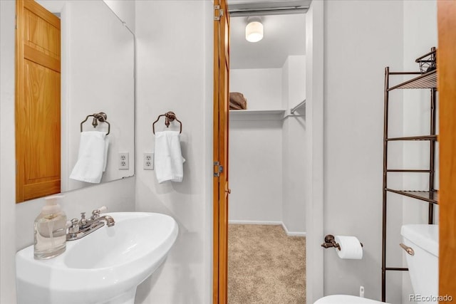 32217 Buffalo Park Rd, Evergreen, CO 80439 - half bath with a sink and toilet