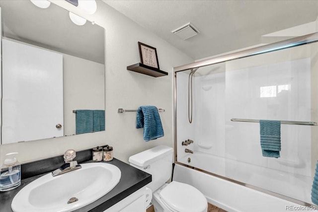 32217 Buffalo Park Rd, Evergreen, CO 80439 - bathroom with vanity, toilet, and shower / bath combination with glass door