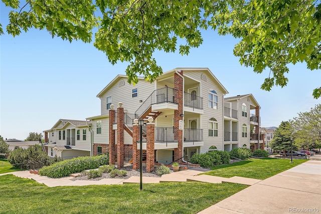 1648 S Cole St Unit A2, Lakewood, CO 80228 - view of property featuring stairway and a residential view