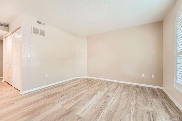 1648 S Cole St Unit A2, Lakewood, CO 80228 - empty room featuring light wood-style flooring and baseboards