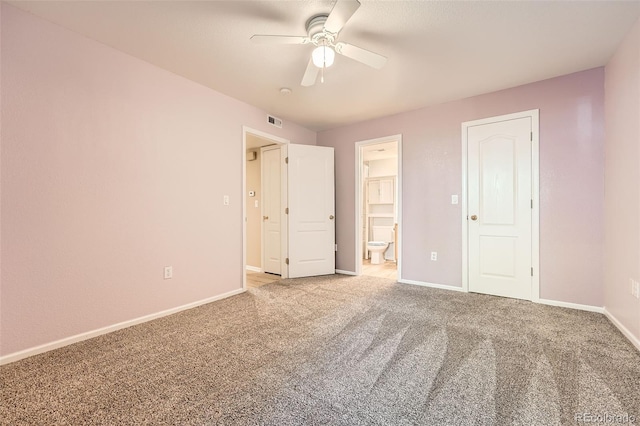 1648 S Cole St Unit A2, Lakewood, CO 80228 - unfurnished bedroom with carpet, baseboards, ensuite bathroom, and ceiling fan