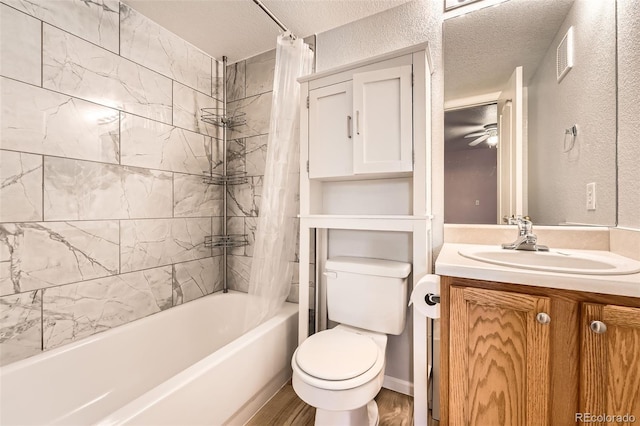 1648 S Cole St Unit A2, Lakewood, CO 80228 - full bathroom with shower / bath combo, vanity, toilet, a textured ceiling, and a textured wall