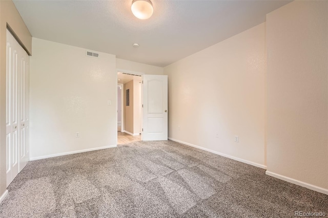 1648 S Cole St Unit A2, Lakewood, CO 80228 - unfurnished bedroom featuring light colored carpet and baseboards