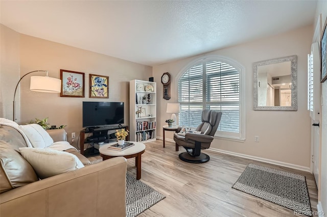1648 S Cole St Unit A2, Lakewood, CO 80228 - living room featuring wood finished floors and baseboards