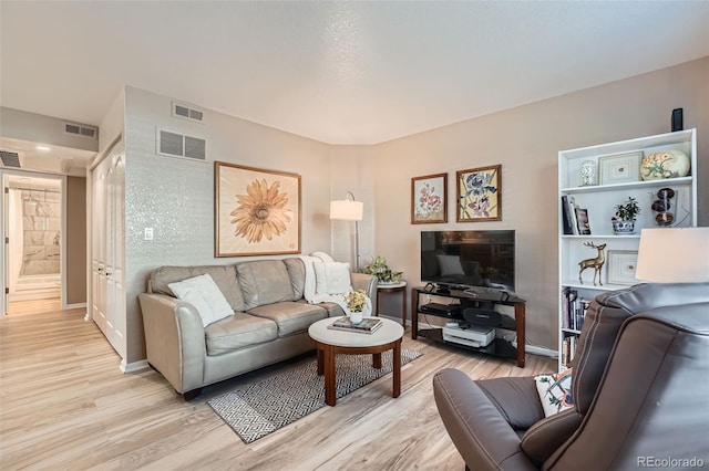 1648 S Cole St Unit A2, Lakewood, CO 80228 - living area with light wood-style flooring and baseboards