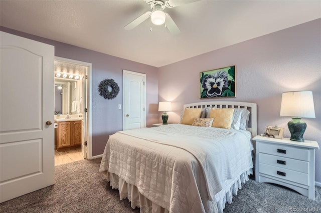 1648 S Cole St Unit A2, Lakewood, CO 80228 - bedroom with carpet flooring, ensuite bathroom, a ceiling fan, and baseboards