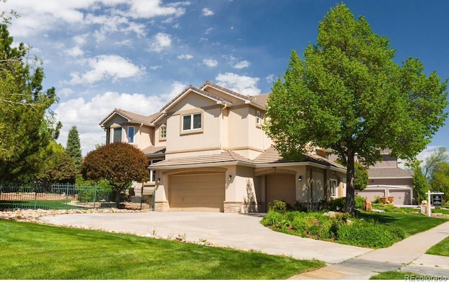 view of front facade with stucco siding, a garage, stone siding, concrete driveway, and a tile roof