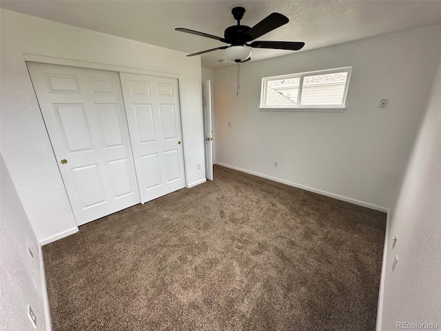 15555 E 40th Ave Unit 11, Denver, CO 80239 - unfurnished bedroom featuring carpet floors, a closet, and a ceiling fan
