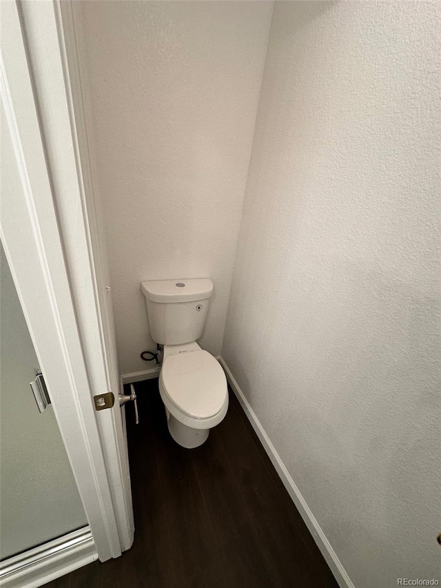 15555 E 40th Ave Unit 11, Denver, CO 80239 - bathroom with baseboards and wood finished floors