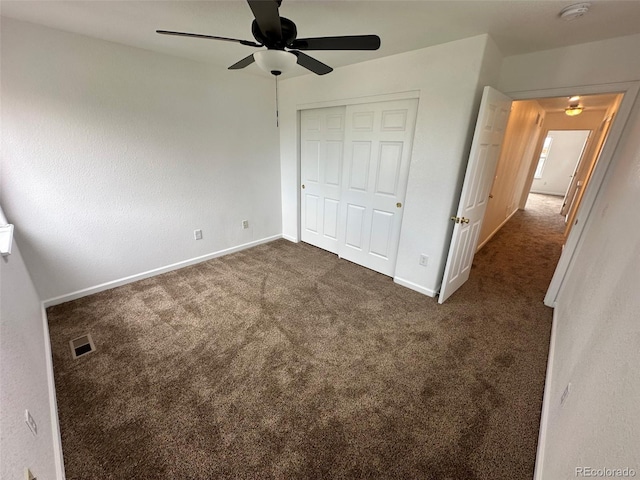 15555 E 40th Ave Unit 11, Denver, CO 80239 - unfurnished bedroom featuring a closet, carpet, and a ceiling fan