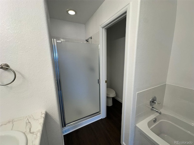 15555 E 40th Ave Unit 11, Denver, CO 80239 - full bath with a stall shower, a garden tub, wood finished floors, and vanity