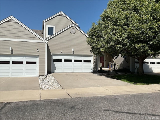 15555 E 40th Ave Unit 11, Denver, CO 80239 - view of front facade featuring concrete driveway