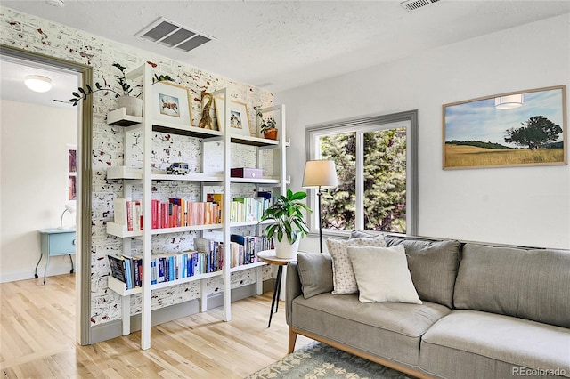 10887 Goodheart Ave, Conifer, CO 80433 - sitting room with wood finished floors