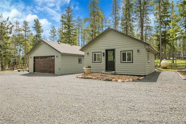 10887 Goodheart Ave, Conifer, CO 80433 - view of front of house with a garage