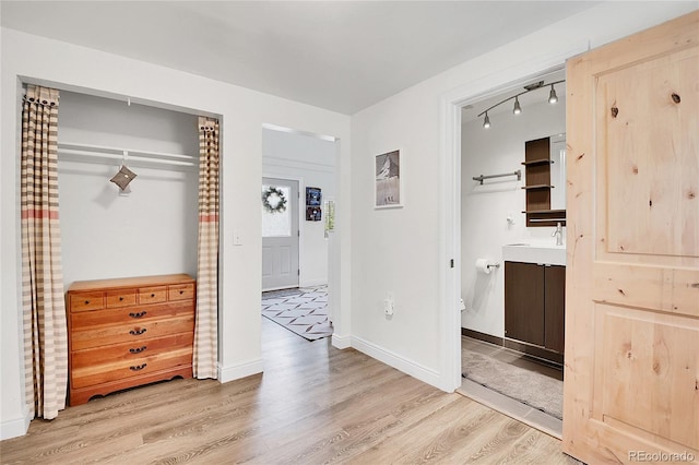 10887 Goodheart Ave, Conifer, CO 80433 - bedroom with wood finished floors, track lighting, and baseboards