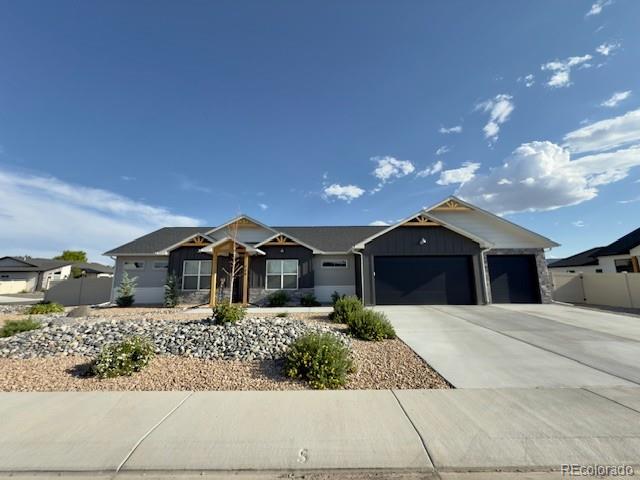 734 Flamecrest Dr, Fruita, CO 81521 - view of front of house featuring a garage and concrete driveway