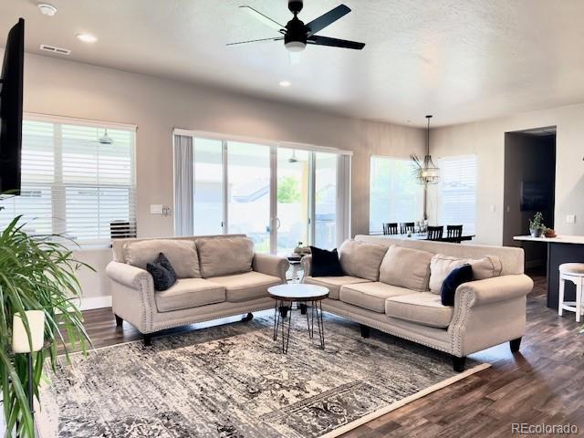 734 Flamecrest Dr, Fruita, CO 81521 - living room with ceiling fan, dark wood-style flooring, and recessed lighting