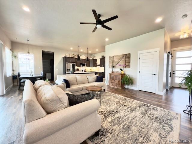 734 Flamecrest Dr, Fruita, CO 81521 - living area featuring a ceiling fan, dark wood-style flooring, and recessed lighting