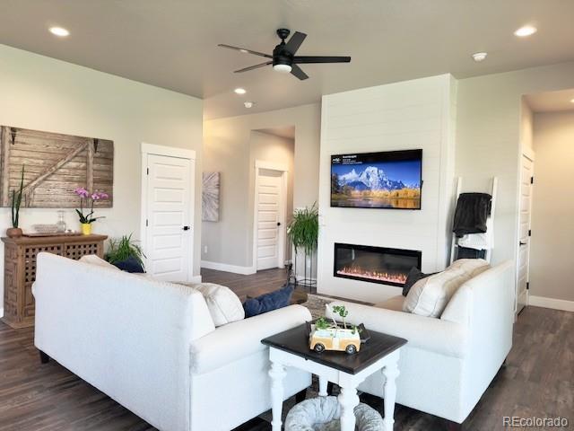 734 Flamecrest Dr, Fruita, CO 81521 - living room with ceiling fan, dark wood-type flooring, recessed lighting, and a glass covered fireplace