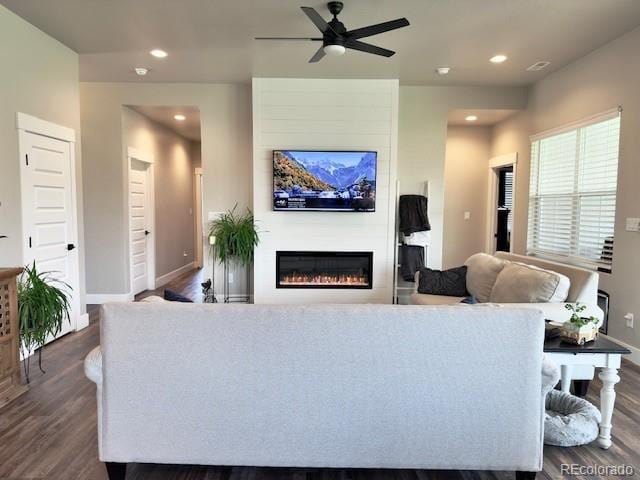 734 Flamecrest Dr, Fruita, CO 81521 - living room with dark wood-type flooring, a ceiling fan, a glass covered fireplace, and recessed lighting