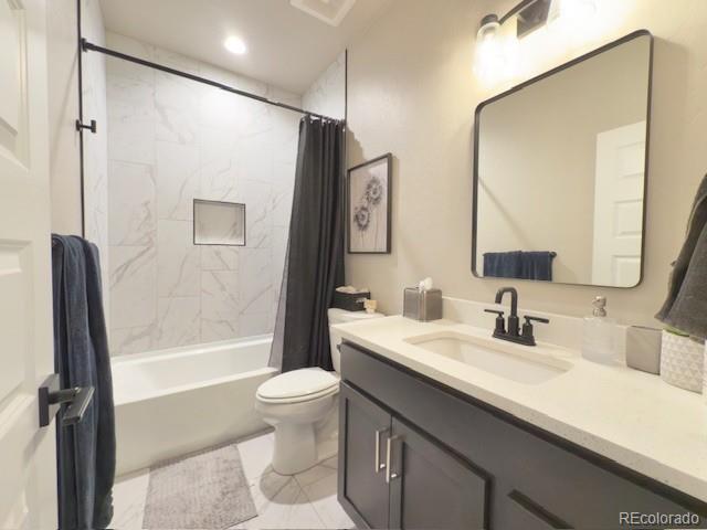 734 Flamecrest Dr, Fruita, CO 81521 - bathroom featuring vanity, shower / bath combination with curtain, and tile patterned flooring