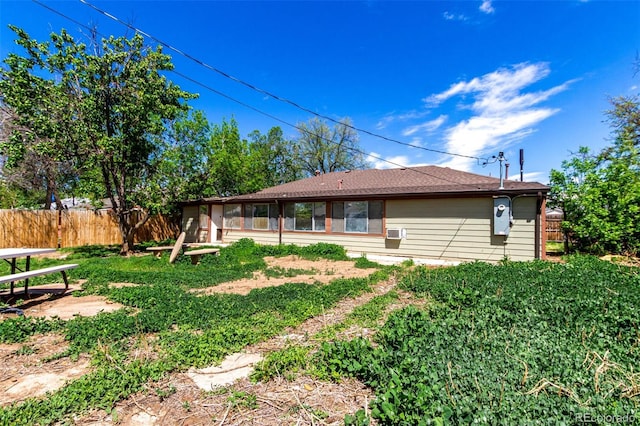 1151 Revere St, Aurora, CO 80011 - rear view of house with a sunroom and cooling unit