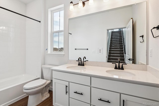 8462 Eagle River St, Littleton, CO 80125 - bathroom with toilet, a sink, double vanity, and wood finished floors