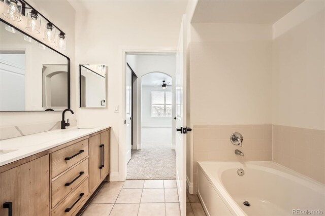 9079 E Panorama Cir Unit 419, Englewood, CO 80112 - full bath featuring a garden tub, double vanity, tile patterned flooring, and baseboards