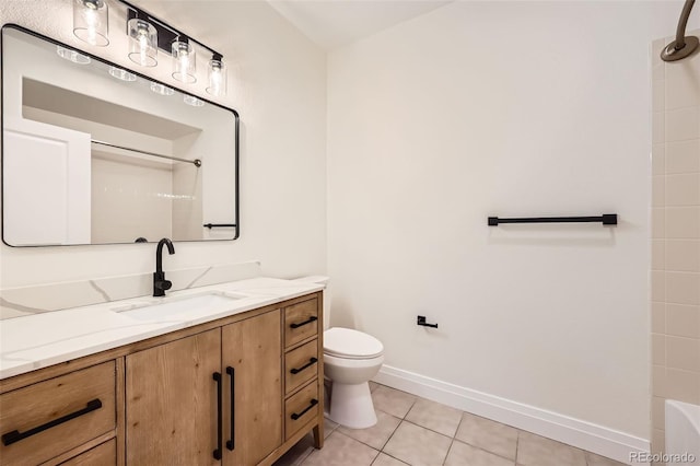 9079 E Panorama Cir Unit 419, Englewood, CO 80112 - full bathroom with vanity, toilet, tile patterned flooring, and baseboards