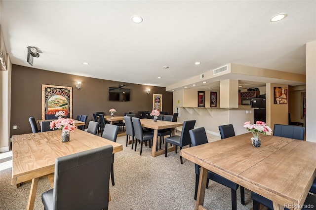 9079 E Panorama Cir Unit 419, Englewood, CO 80112 - dining area with light colored carpet, recessed lighting, and baseboards