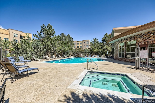 9079 E Panorama Cir Unit 419, Englewood, CO 80112 - community pool featuring a community hot tub and a patio area