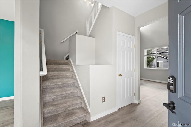 1160 S Fultondale Ct, Aurora, CO 80018 - staircase with baseboards and wood finished floors