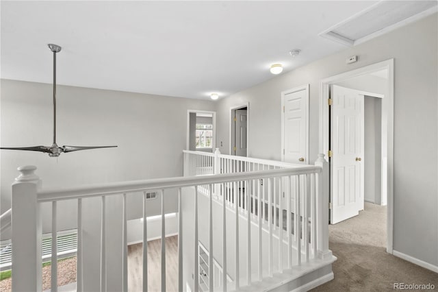 1160 S Fultondale Ct, Aurora, CO 80018 - corridor featuring an upstairs landing, carpet floors, and baseboards