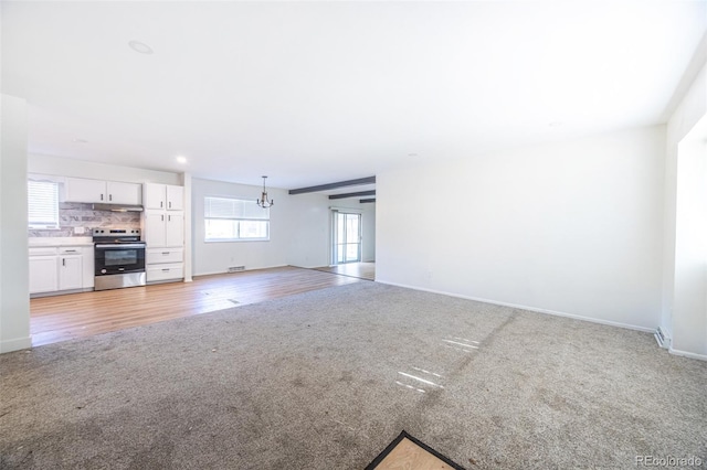 unfurnished living room featuring light wood-type flooring