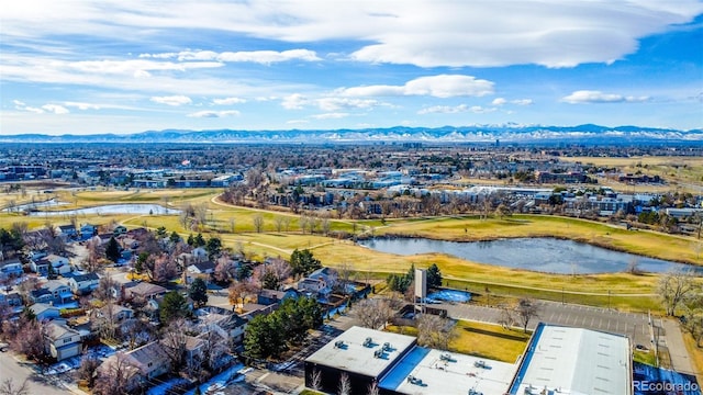 drone / aerial view featuring a water and mountain view